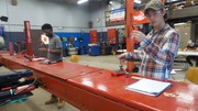 Section 3 Students undergoing basic automotive electrical theory testing.